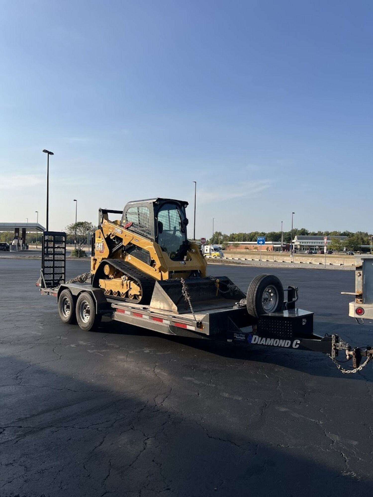 J&M equipment trailer hauling a skid steer loader in Lorain, Ohio
